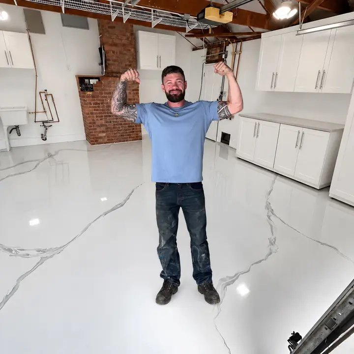 Josh standing on a finished white metallic epoxy garage floor in San Jose, CA